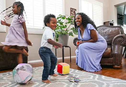 Person and children playing