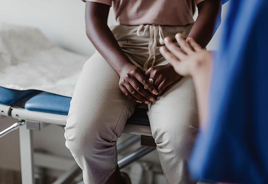Women sits in doctors office
