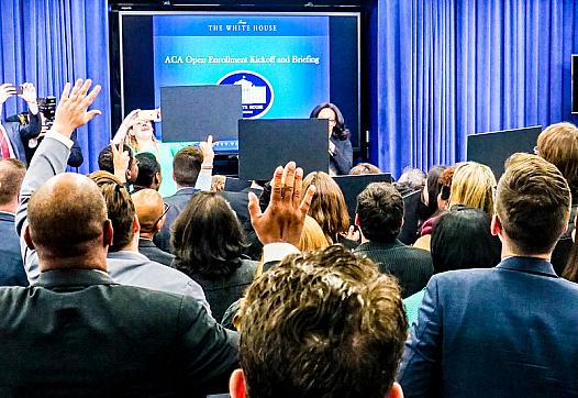 People raising their hand in a speech