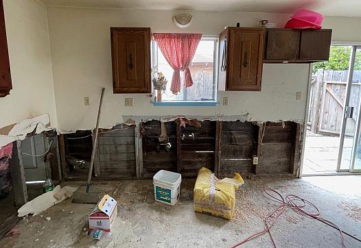 Image of a home destroyed by the flood.