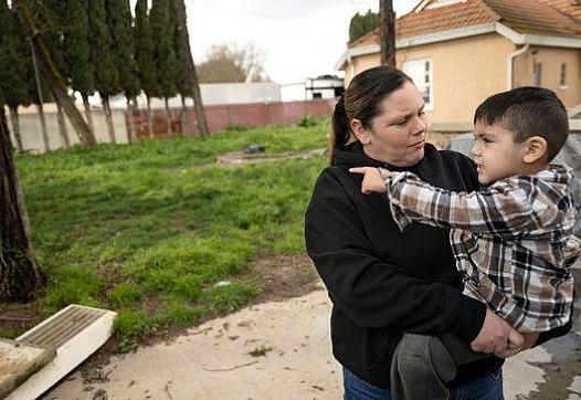 A person and a child in arms