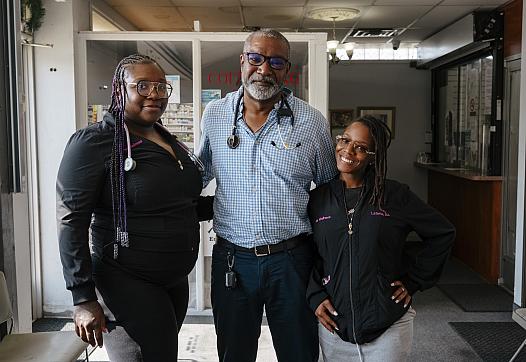 Three people standing together