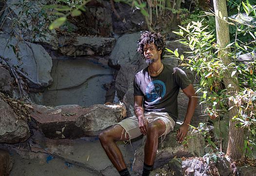 Person sitting on rocks