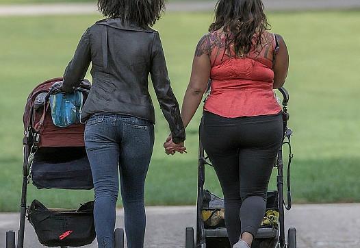 Image of two mother walking with their stroller