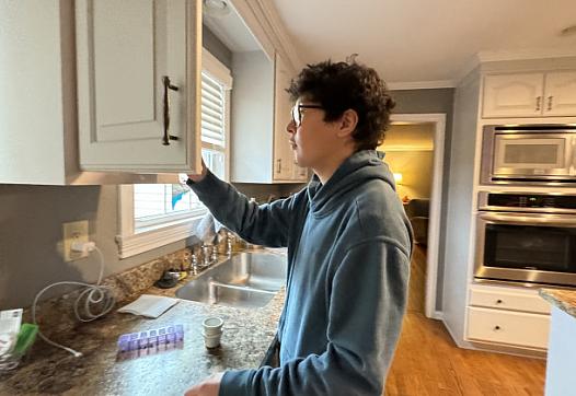 person looking into a cupboard