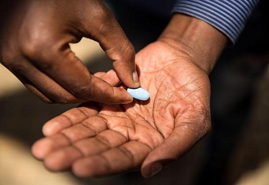 A person holding a pill