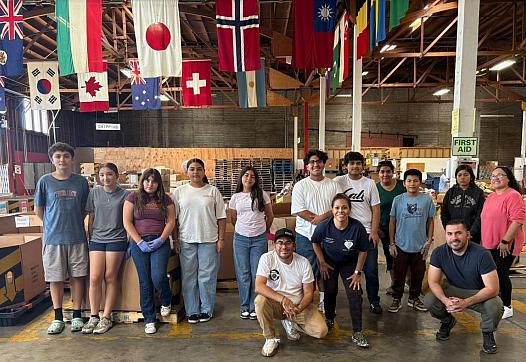 Group photo under multiple flags