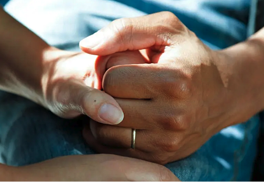 Person holding other person hand