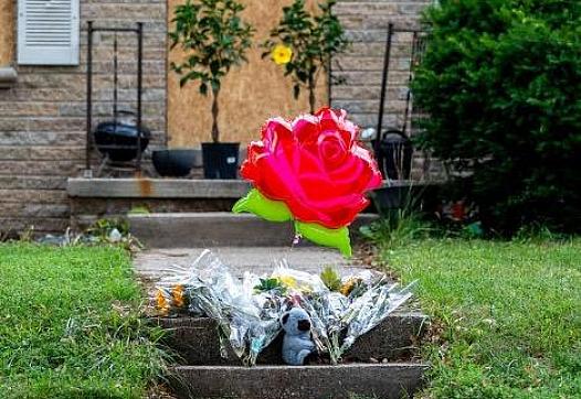 Balloons and flowers outside a home