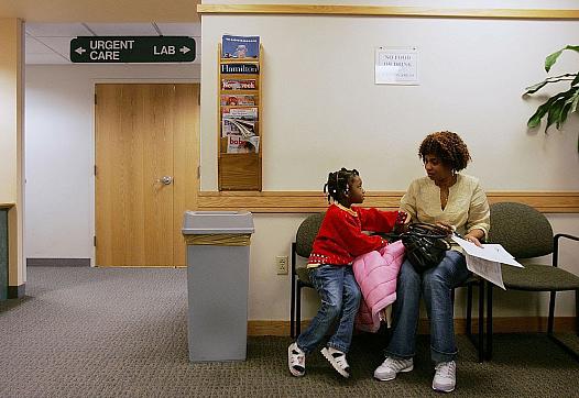 A person sitting with their child in the clinic's waiting area