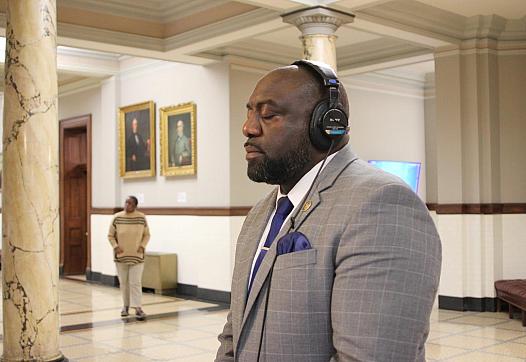 A person in suit with headphones