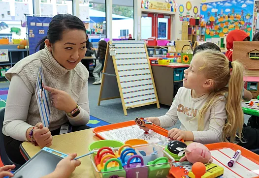 A child and her teacher