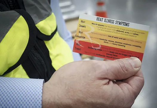 A person holding a card