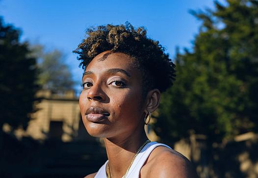 Shamari White, 26, poses for portraits at Meridian Hill/ Malcolm X park in Washington, D.C., on March 5, 2023. White experienced suicidal ideation and self-harm due to bullying and sexualization in middle school. (Maen Hammad/Word In Black)