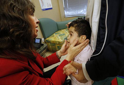 Catherine Mazzola examines 7-year-old Diego Giraldo, one of her Medicaid patients. (Robert Sciarrino | NJ Advance Media for NJ.com)