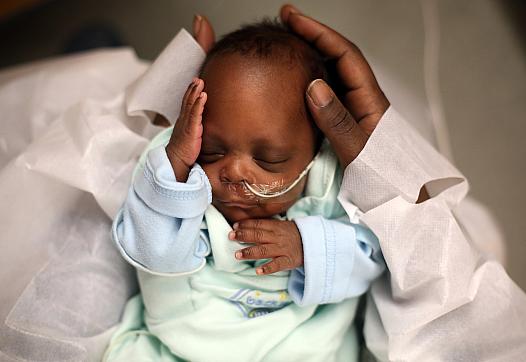 A baby recovers in the neonatal intensive care unit of an Indiana hospital in 2014. The state is among those that recently passe