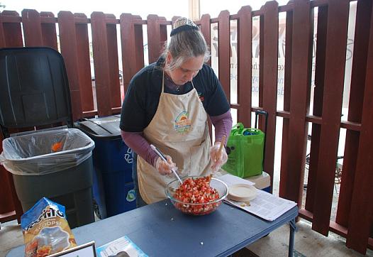 Rose Brown makes pico de gallo at Pacific Pantry's one-year anniversary celebration in May.