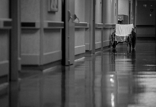 An empty wheelchair is seen in the hallway at Texas Vista Medical Center in San Antonio, Texas, on Oct. 26, 2021.