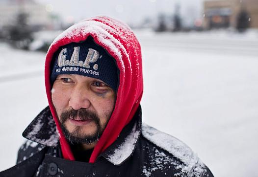 Marc Lester / ADN Albert Edwards panhandles at the entrance to Walmart on Benson Boulevard. He said he has been homeless for five years.