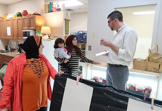 Reporter Justin Murphy speaking with parents at the EarlyOn child and family center in Windsor, Ontario for the Time To Educate