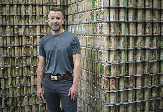 Brewer Jeff Erway stands next to his signature beer, Elevated. La Cumbre Brewing Co. is one of New Mexico's largest craft beer c