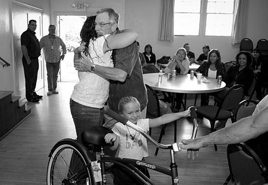 Casa Serena executive director Craig Belknap gets a hug from a grateful Santa Barbara County Sheriff’s Treatment Program graduat