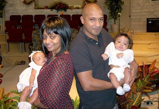 Latrelle Huff, left, is shown with her former boyfriend and their twins at the babies' baptism in 2014. 