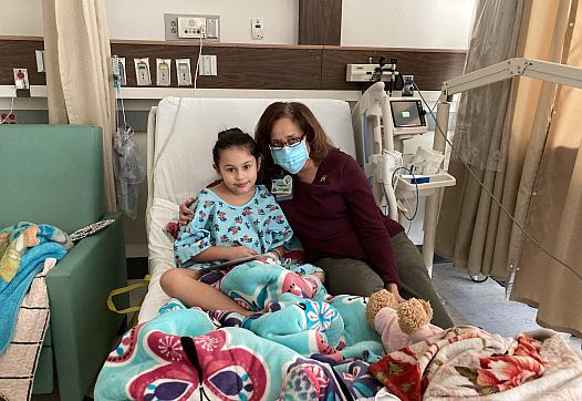 Brianna, 8, with author Dr. ChrisAnna Mink, during her January stay at Harbor-UCLA Medical Center, where she was treated for a C