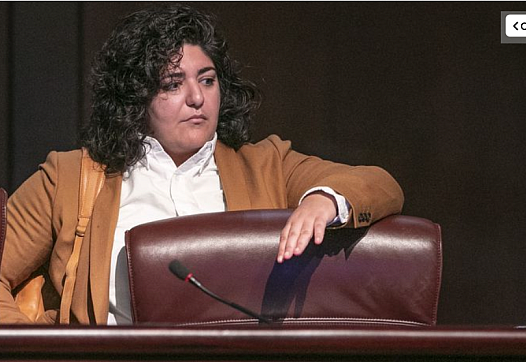 Council member Liliana Bakhtiari prepares to take her seat on the dais as the Atlanta City Council held their first in person me