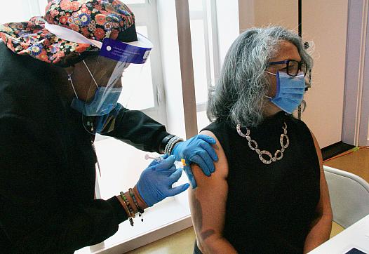 Woman receives vaccine