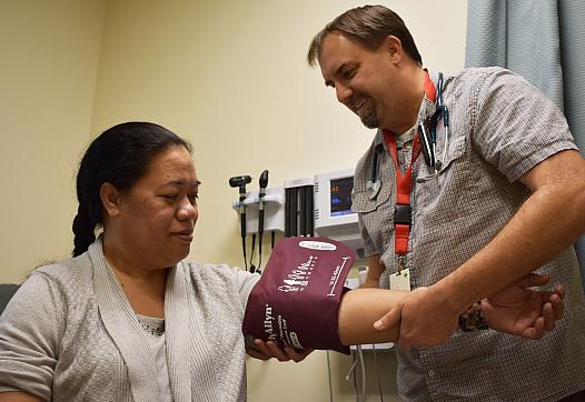 A patient at the Ravenswood Family Health Center in East Palo Alto has her blood pressure checked. In 2017, about 87 percent of 