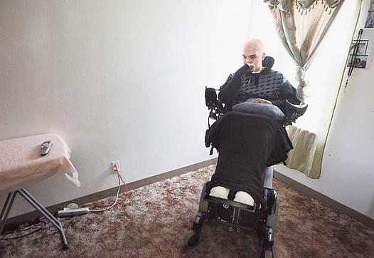 Joel Aguilar, shown April 14 in his Salinas home, reflects about the night he was shot. Aguilar is paralyzed from the waist down