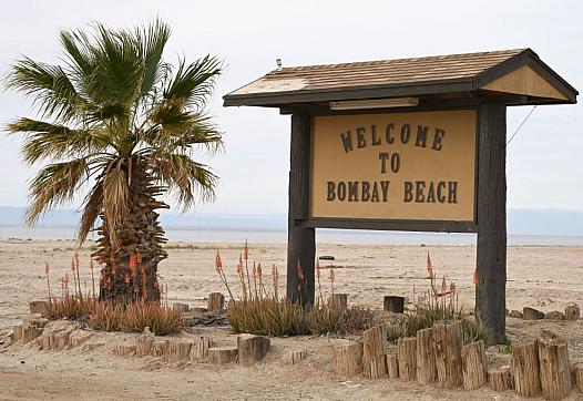 A sign advertises a once-thriving resort community along the shores of the Salton Sea.