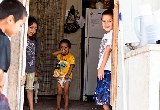 Four of the five children who live in this dilapidated one-room home in Mexico Chiquito, a colonia in the Rio Grande Valley.