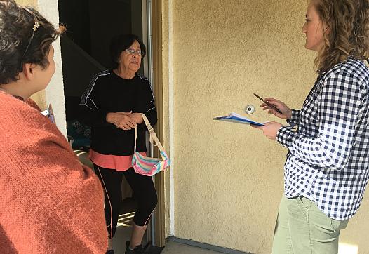 Lindsey Holden and Promotora Silvia Santini interview a tenant while canvassing around San Luis Obispo County.