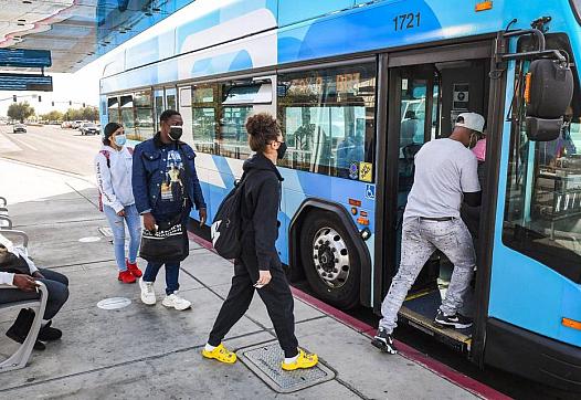 Passengers board a FAX bus at a stop near Manchester Center in Fresno. In Fresno County, about 65% of all jobs are within a 10-m