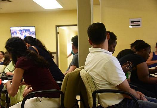 Patients awaiting their doctors appointments in the waiting room of a Livingston Community Health clinic in Livingston on Aug. 3