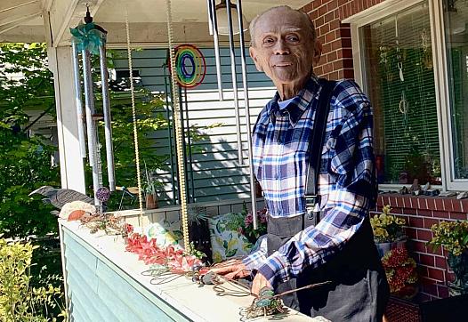 Gene Ampon, 75, photographed in August 2021 on the porch of the Seattle home he shared with his life partner for decades. Wind c
