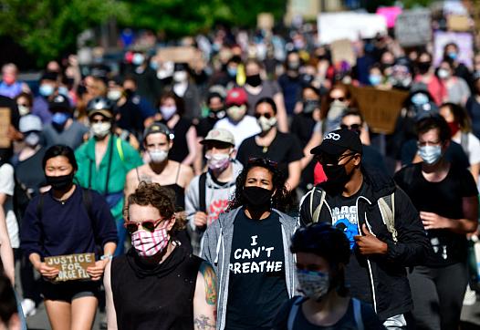 Protesters march in Philadelphia, Pennsylvania, in early June. For many, the urgency of ending police violence and harassment dr