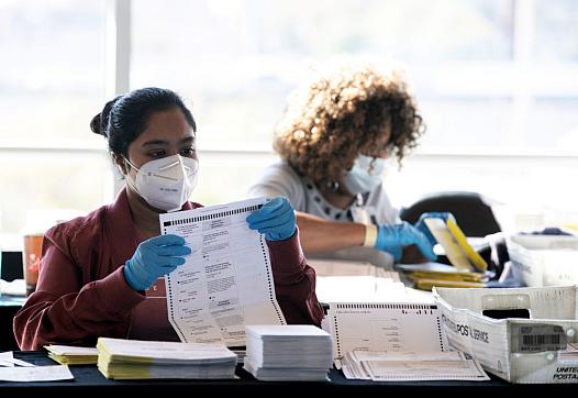 An election worker counts ballots in Atlanta, Georgia on Nov. 4.