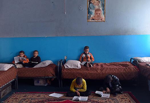 Children shown in an orphanage. (Photo by Wakil Kohsar/AFP via Getty Images)   