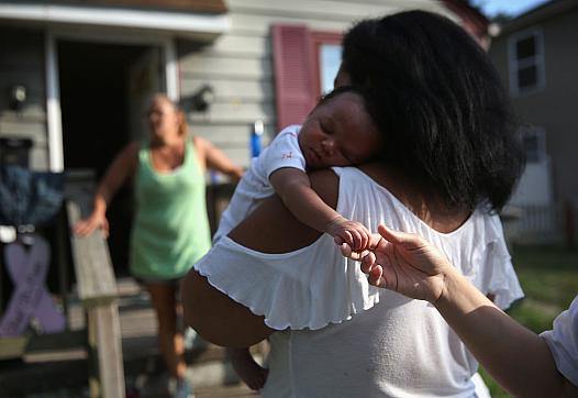 Grandmother Valencia Terrell arrives with her grandchild to stay temporarily at a friend's home on in Atlantic City. After her h