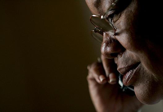 Kathy Curry of New Orleans cries as she learns that her daughter cannot make it for Thanksgiving and Christmas