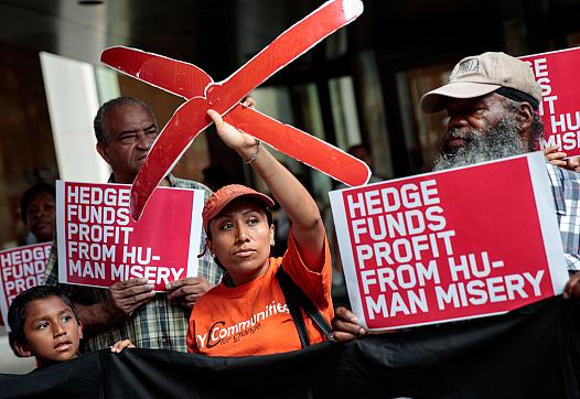 Activists rally during a protest against the price of EpiPens, outside the office of hedge fund Photo: Drew Angerer/Getty Images