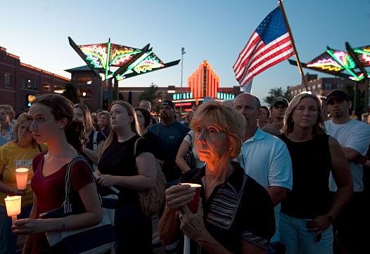 Dea Deujsch (C) participates in a candle light vigil for Dr. George Tiller in Old Town May 31, 2009 in Wichita, Kansas. Dr. Geor