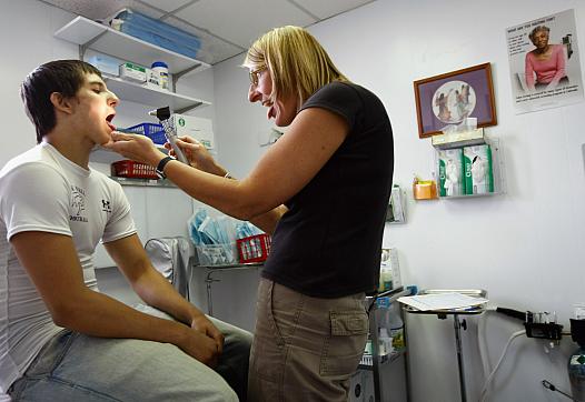 Doctor examines patient