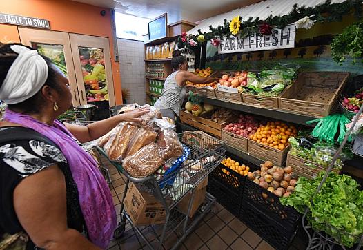People on low-incomes and retirees buy food at the World Harvest Food Bank in Los Angeles.