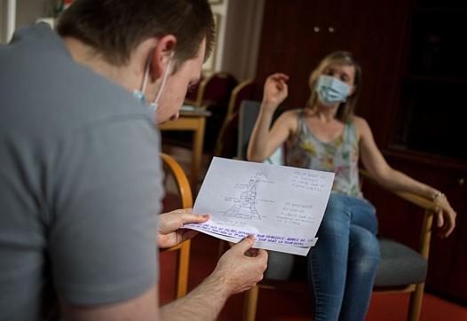 A psychiatrist works with a young patient 