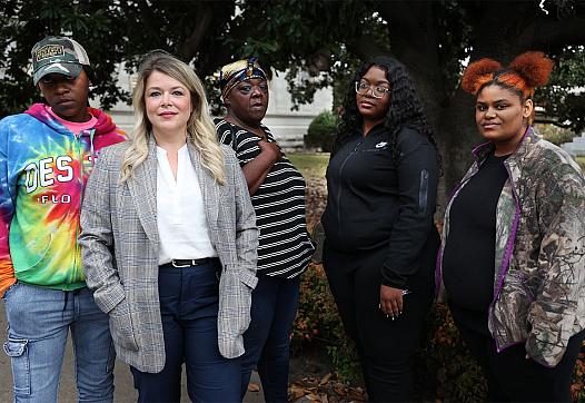 Bratika Green, Jordan Hughes, Debra Peterson, Jessica Griffin and Kanesha Head stand outside the Leflore County Courthouse in Gr