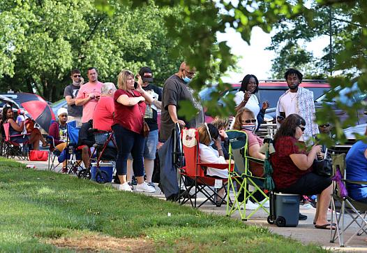 Hundreds of unemployed residents wait in long lines outside the Kentucky Career Center for help with their unemployment claims F